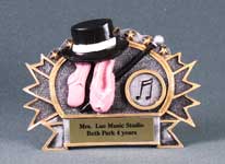 This is a dance award featuring dance slippers with top hat and cain