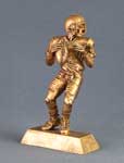 This is a image of a gold tone football player ready to pass