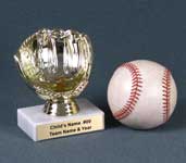 Image of a gold baseball glove ball holder on a white marble base